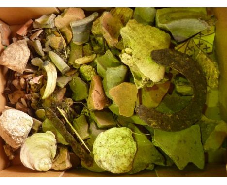 A box containing a quantity of roman and ancient artefacts and fragments to include pieces of terracotta tile, pottery fragme