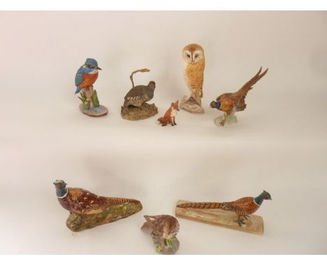 A collection of ceramic animals and birds including a Beswick model of a seated fox with impressed numbers to base 174 (?), t