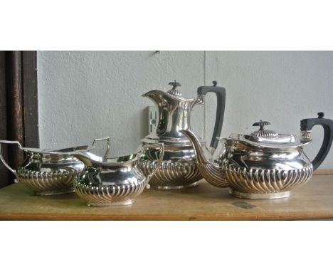 An A1 silver plated coffee pot, teapot, two handled sugar basin and milk jug, all with vertical fluted embossed detail, the p