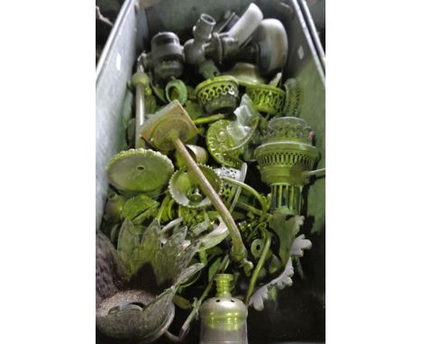 A vintage industrial steel tray with applied looping handles containing a collection of electronic and gas lamp and lighting 