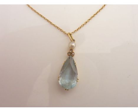 A Victorian style pendant, claw-set with a pear-shaped untested aquamarine weighing approximately 4cts, highlighted above wit