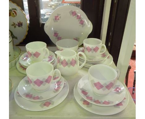 A collection of Shelley Pink Harlequin pattern tea wares number 14199 comprising milk jug, sugar bowl, cake plate, four cups,