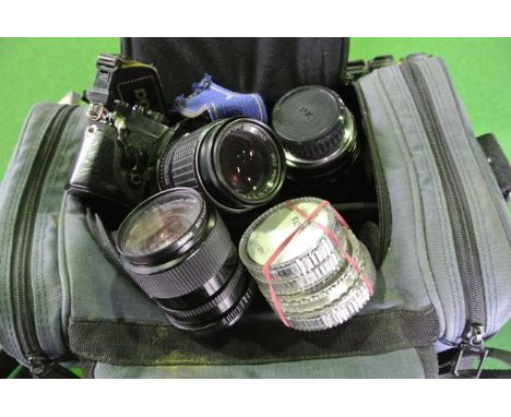 A vintage Miranda camera fitted with a Pentax 135 mm lens, a further Miranda lens, a Hama macro lens, various light filters, 