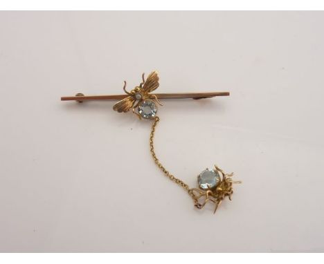 A Victorian bar brooch, centred with a bug motif, set with an untested pale blue gemstone, possibly aquamarine, and a seed pe