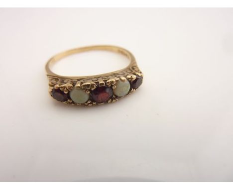 An Edwardian gem-set ring, set with three untested garnets and two opals, in 9ct gold, size O