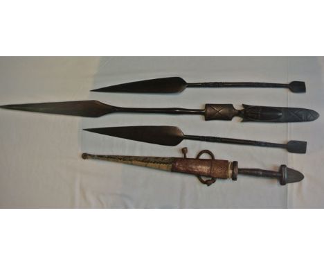 Three African hardwood spears with carved detail, and a north African dagger with lizard skin scabbard (the dagger displayed 