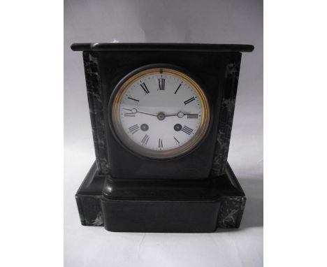 A Victorian black slate and marble mantle clock with eight day striking movement