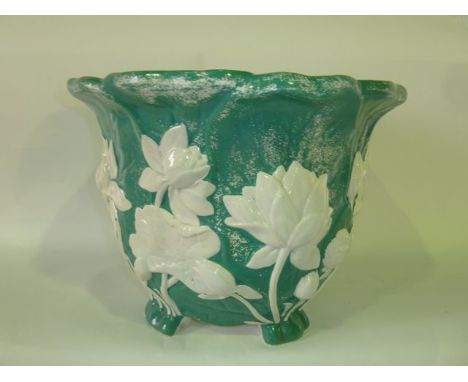 A 19th century Minton jardinière with relief moulded water lily decoration on a jade green painted ground, with impressed Min