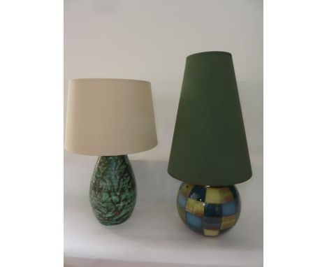 A Jersey Pottery table lamp base of globular form with glazed and unglazed patchwork finish, with tapering green shade togeth