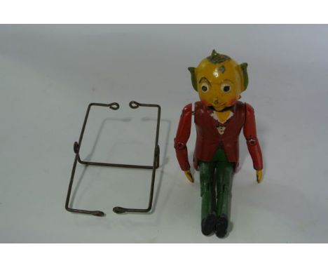 A vintage die cast model of Mr Turnip Head with jointed body and brightly coloured painted finish, 17 cm tall approx