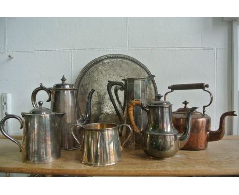 A silver plated coffee pot with scrolling embossed handle, a small 19th century copper kettle, an electroplated three piece d