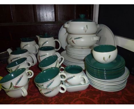 A quantity of Denby Green Wheat pattern dinner and tea wares including a pair of two handled tureens and covers, oval meat pl