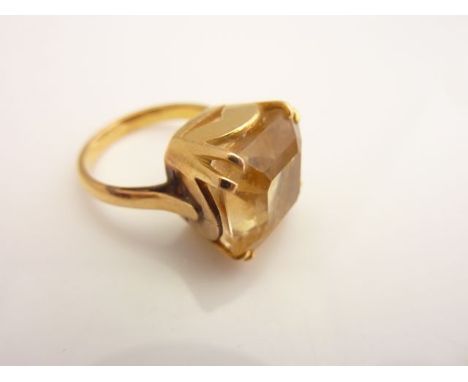 A dress ring, set with an untested citrine weighing approximately 7.65cts, in unmarked gold, size J