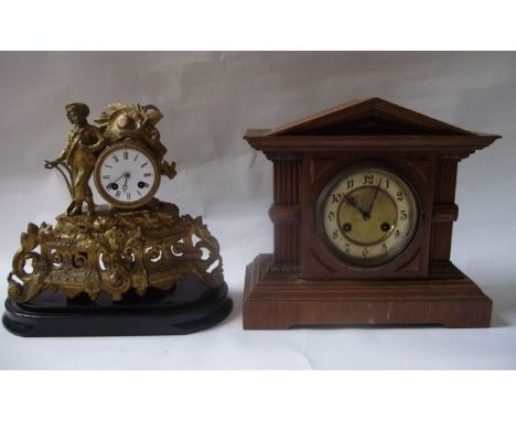 A 19th century gilt spelter mantle clock, the cast and pierced cased supporting a drum movement with enamel dial surmounted w