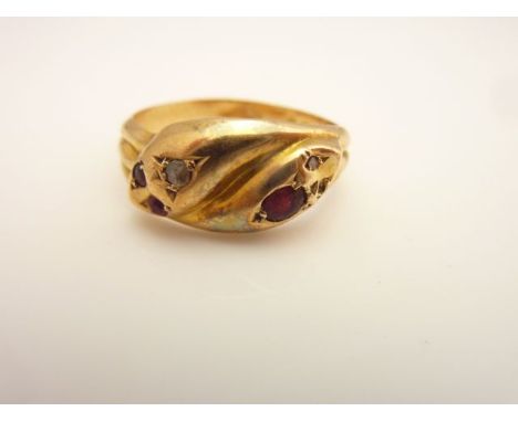 An Edwardian snake ring, composed of two snake heads intertwining, set with untested rubies and rose-cut diamonds, in 18ct go