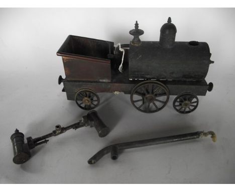A good quality 19th century model of a steam engine, principally in brass, running on six wheels over three axles