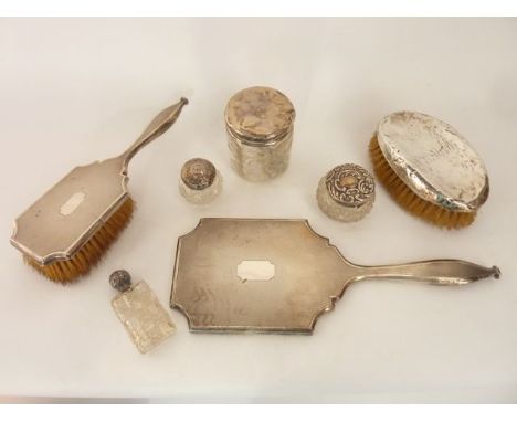 A miscellaneous collection of silver dresser items, various makers, London & Birmingham, 1904 - 1931, comprising: a hair brus