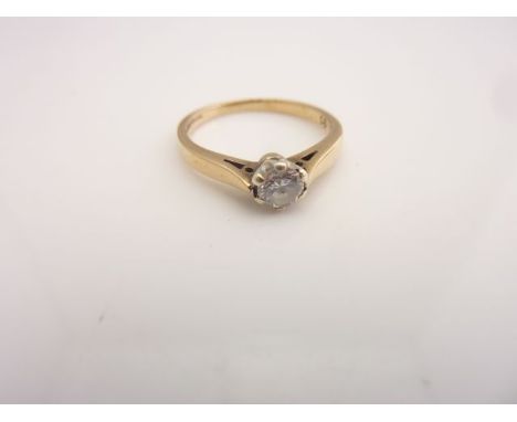 A solitaire diamond ring, claw-set with a round brilliant-cut diamond weighing 0.25cts, in 9ct white and yellow gold, size J 