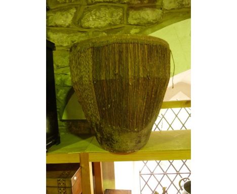 A substantial vintage drum of barrel form, believed to be African, with stretched hide and tallow surface, 50 cm tall approx
