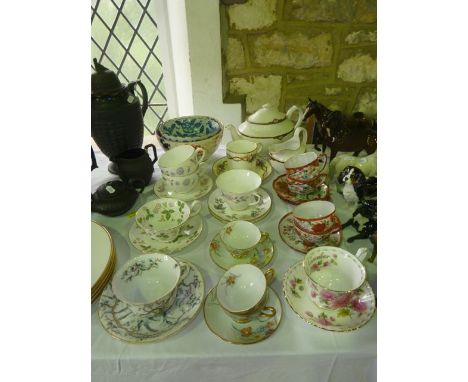 A collection of ceramics including a Spode Harvard pattern teapot, milk jug and sugar bowl, various decorative cups and sauce