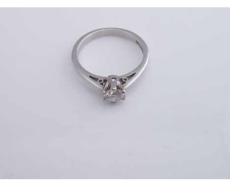 A solitaire diamond ring, claw-set with a round brilliant-cut diamond weighing approximately 0.35cts, in 9ct white gold, size