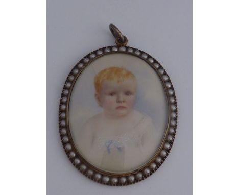 An oval miniature painted portrait of a young child in a simulated pearl mounted frame
