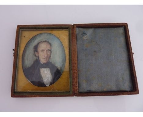 A mid-19th century portrait painting of a middle aged man in a black jacket, in a folding leather case