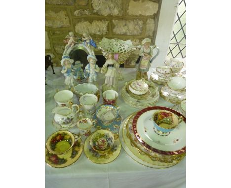 A collection of continental and other decorative ceramics including a 19th century ceramic framed mirror of oval form with ap