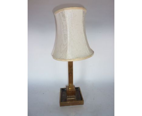 A single good quality heavy brass table lamp, the squared stem with simple blocked capital upon a heavy squared base accommod