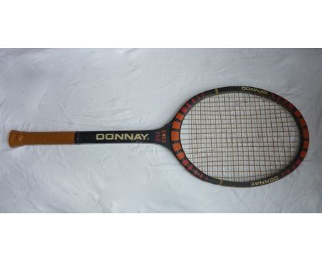 A vintage oversized tennis racket for display use bearing text - Donnay Borg Pro, 128 cm long approx