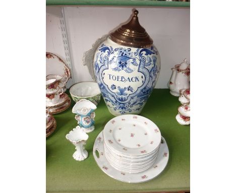 A large Dutch Delftware outsized tobacco jar and cover with blue and white painted decoration in the 17th century manner, ins