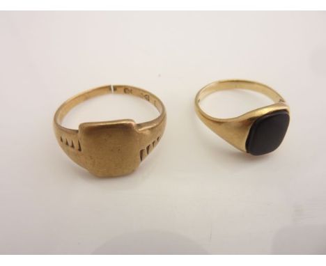 A 9ct gold signet ring, centred with a cushion-shaped onyx, size N; and a 9ct gold signet ring, band cut, 5g (2)