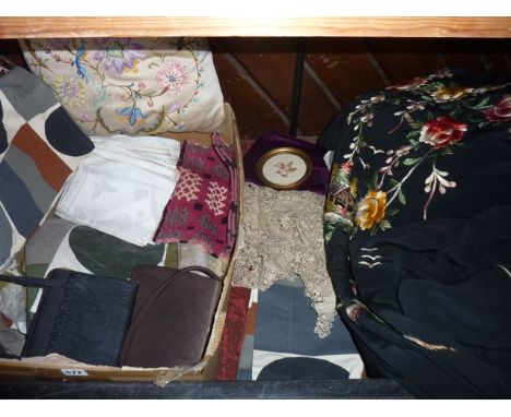 A quantity of vintage textiles and effects to include a black ground oriental kimono with brightly coloured embroidered folia
