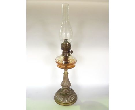 A 19th century oil  lamp with brass base and clear cut fount, complete with clear glass chimney, 66 cm tall approx including 