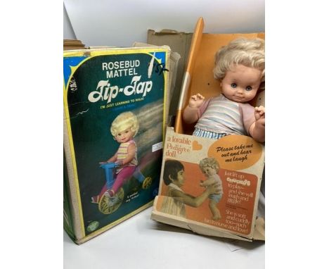Vintage 1960s Pedigree Chuckles Baby doll together with a Mattel Rosebud Tip tap toddler doll on bicycle-both dolls are playw