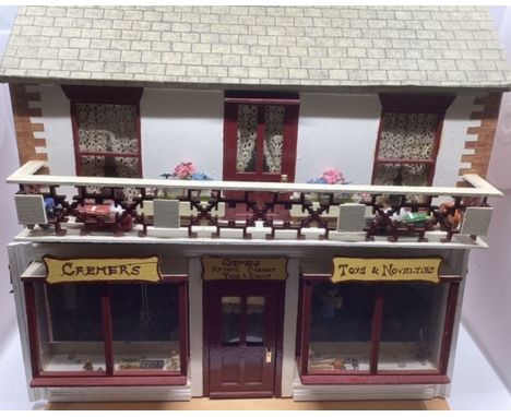 Vintage dolls House toy shop with contents; a wooden built dolls house with attic space and furnishings and extensive range o