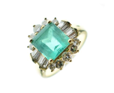 Emerald and diamond dress ring, stamped '18KT', the step cut emeralds measuring approximately 8.8mm x 8.4mm and 5.9mm deep, e