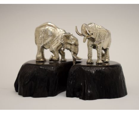 Patrick Mavros silver figure group depicting two African elephants at a waterhole, the blackwood base with inset button, over