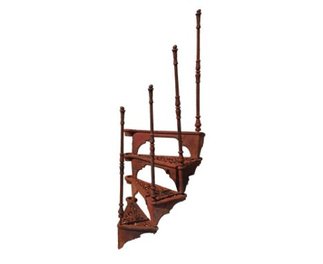 Cast iron spiral staircase comprising: fourteen steps, each with pierced scroll decoration, twelve 84cm balustrade spindles a