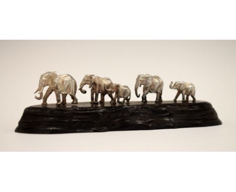 Patrick Mavros silver figure group depicting a family of five African elephants, the blackwood base with inset button, overal