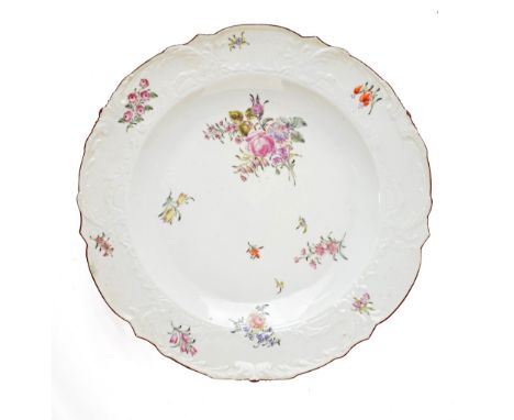 18th Century Chelsea porcelain plate having polychrome painted foliate decoration and moulded border, red triangle mark, 28.2