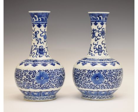 Pair of Chinese baluster shaped vases, each having blue and white painted decoration depicting various artefacts and a band o