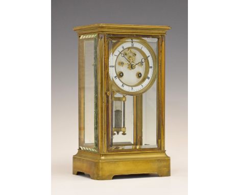 Brass cased four glass mantel clock, the white enamel dial with Roman numerals and visible escapement, mercury pendulum, 26.7