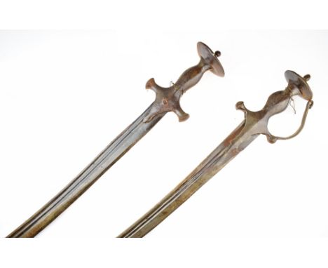 Two Indian swords Tulwar, the first of all steel construction, grip of characteristic form with disc pommel, knuckle bow shor