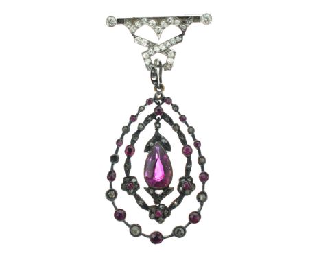 Ruby and rose diamond pendant, the tear shaped ruby, approximately 9.5mm long x 6.2mm wide x 3.7mm deep, suspended within a r