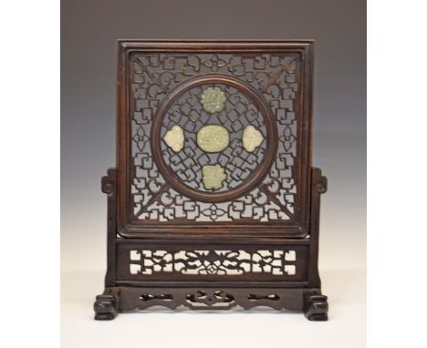 Late 19th/early 20th Century Chinese carved hardwood table screen, the sliding panel inset with four carved jade panels, 57cm