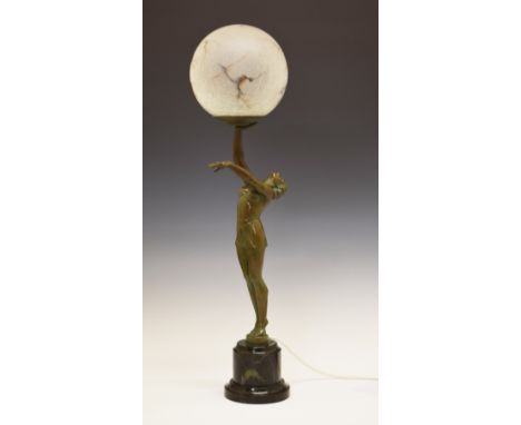 Art Deco design bronzed spelter figural table lamp formed as a lady dancer holding a brown veined crackle glazed shade aloft,