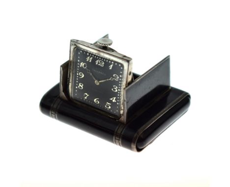 Tavannes - Black enamel and silver purse watch, the black square dial with steel Arabic numerals and hands, the squeeze open 