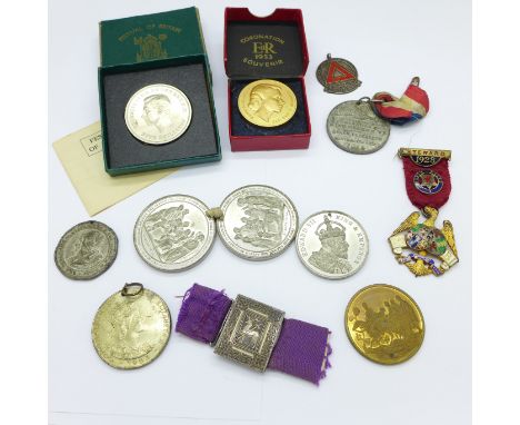 Medallions including one silver and enamel and a buckle