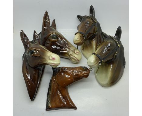 Four ceramic horse's head wall plaques including Jema, Holland
